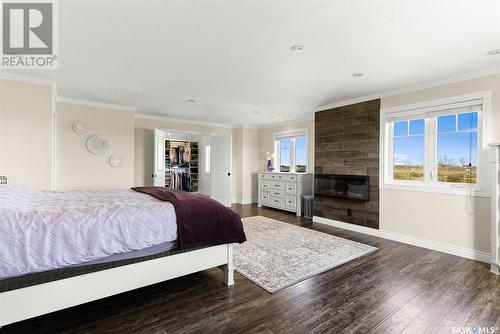 13 Hood Road, Longlaketon Rm No. 219, SK - Indoor Photo Showing Bedroom With Fireplace