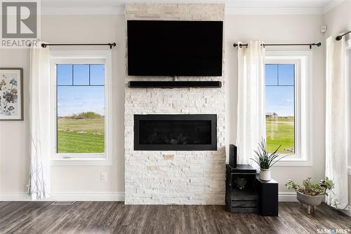 13 Hood Road, Longlaketon Rm No. 219, SK - Indoor Photo Showing Living Room With Fireplace