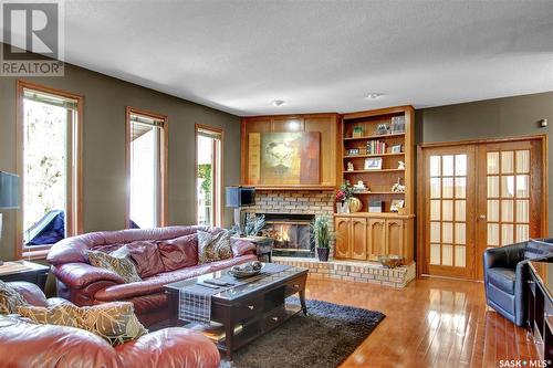 2347 Brodie Bay E, Regina, SK - Indoor Photo Showing Living Room With Fireplace