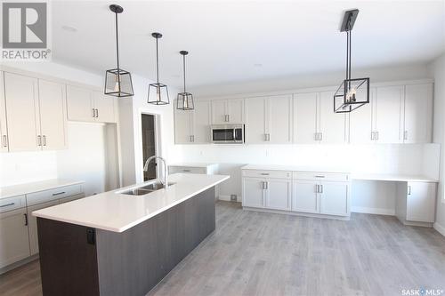 130 Kostiuk Crescent, Saskatoon, SK - Indoor Photo Showing Kitchen With Double Sink