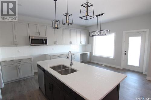 130 Kostiuk Crescent, Saskatoon, SK - Indoor Photo Showing Kitchen With Double Sink