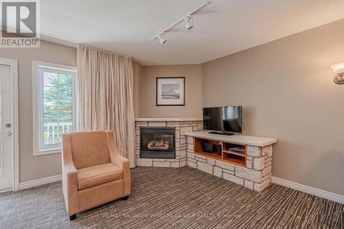 2220-21 - 90 Highland Drive, Oro-Medonte (Horseshoe Valley), ON - Indoor With Fireplace