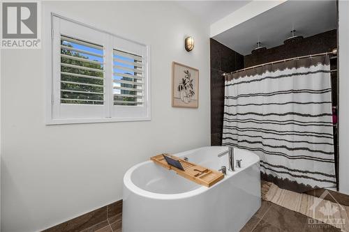 Soaker tub and large shower. - 303 Lanark Avenue, Ottawa, ON - Indoor Photo Showing Bathroom