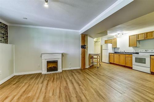 1420 Kelglen Crescent, Kelowna, BC - Indoor Photo Showing Kitchen With Fireplace With Double Sink