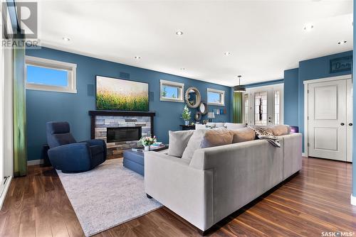 18 Cumberland Bay, White City, SK - Indoor Photo Showing Living Room With Fireplace