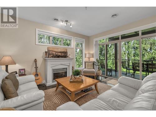 4036 Pritchard Drive N Unit# 3203, West Kelowna, BC - Indoor Photo Showing Living Room With Fireplace