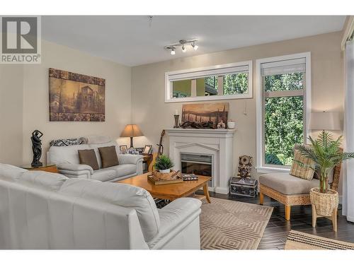 4036 Pritchard Drive N Unit# 3203, West Kelowna, BC - Indoor Photo Showing Living Room With Fireplace