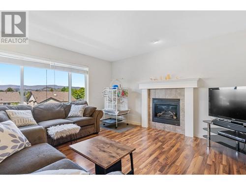 182 Poonian Court, Kelowna, BC - Indoor Photo Showing Living Room With Fireplace