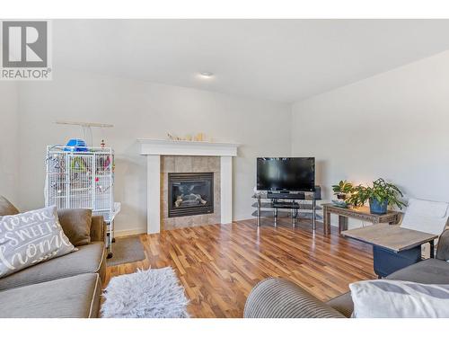 182 Poonian Court, Kelowna, BC - Indoor Photo Showing Living Room With Fireplace