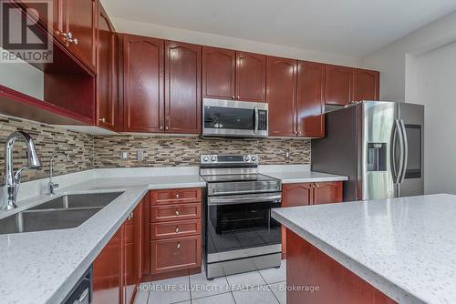 50 Begonia Crescent, Brampton (Northwest Sandalwood Parkway), ON - Indoor Photo Showing Kitchen With Double Sink