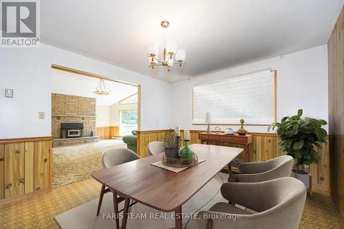 20 Tall Pines Drive, Tiny, ON - Indoor Photo Showing Dining Room With Fireplace