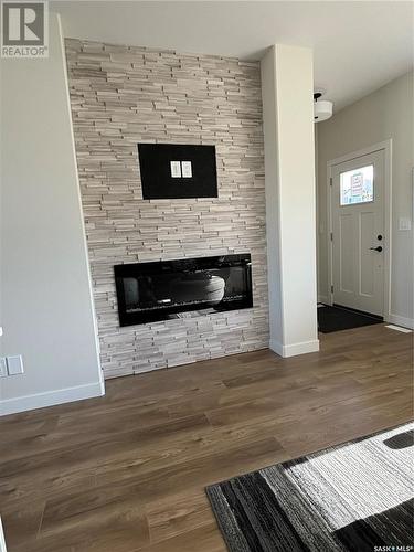 147 Kostiuk Crescent, Saskatoon, SK - Indoor Photo Showing Living Room With Fireplace