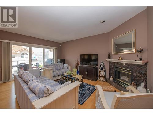 7701 Okanagan Landing Road Unit# 8, Vernon, BC - Indoor Photo Showing Living Room With Fireplace