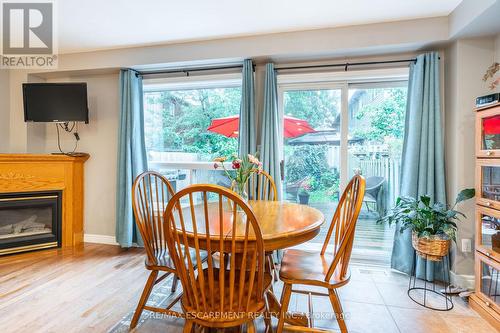 31 - 10 Cadham Boulevard, Hamilton (Broughton), ON - Indoor Photo Showing Dining Room With Fireplace