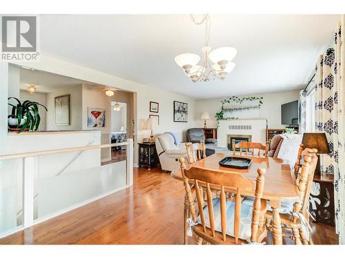 6150 Davies Crescent, Peachland, BC - Indoor Photo Showing Dining Room With Fireplace