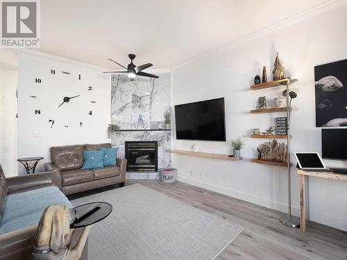 7701 Okanagan Landing Road Unit# 4, Vernon, BC - Indoor Photo Showing Living Room With Fireplace