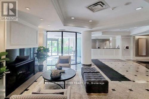 T09 - 16 Dallimore Circle, Toronto (Banbury-Don Mills), ON - Indoor Photo Showing Living Room With Fireplace