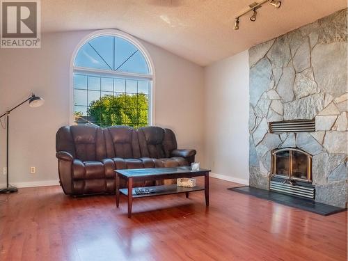 10720 Cottonwood Crescent, Dawson Creek, BC - Indoor Photo Showing Living Room With Fireplace