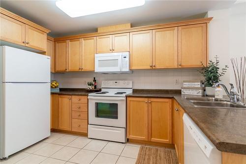 125 Wilson Street W|Unit #216, Ancaster, ON - Indoor Photo Showing Kitchen With Double Sink