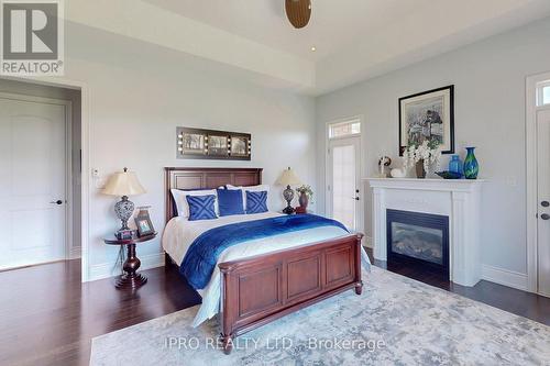 705 Lake Ridge Road S, Whitby, ON - Indoor Photo Showing Bedroom With Fireplace