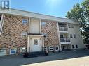 36 228 3Rd Street, Weyburn, SK  - Outdoor With Balcony With Facade 