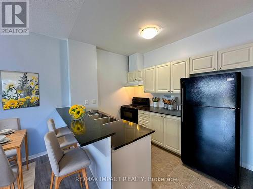 104 - 1 Sidney Lane, Clarington (Bowmanville), ON - Indoor Photo Showing Kitchen With Double Sink