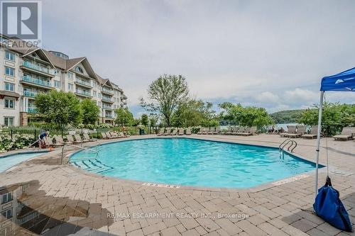 54-304 - 1235 Deerhurst Drive, Huntsville, ON - Outdoor With In Ground Pool