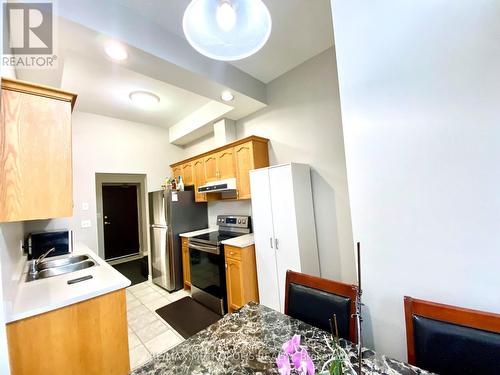 210 - 262 Dundas Street E, Hamilton (Waterdown), ON - Indoor Photo Showing Kitchen With Double Sink