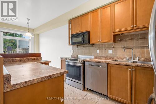 1 - 47 Marina Point Crescent, Hamilton (Stoney Creek), ON - Indoor Photo Showing Kitchen With Double Sink