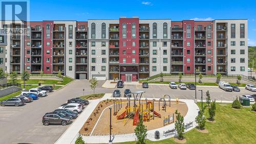 111 - 4 Spice Way, Barrie, ON - Outdoor With Balcony With Facade