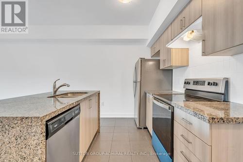 111 - 4 Spice Way, Barrie, ON - Indoor Photo Showing Kitchen With Double Sink