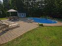 Cour - 74 Rue Antoine-Forestier, Carignan, QC  - Outdoor With In Ground Pool With Backyard 