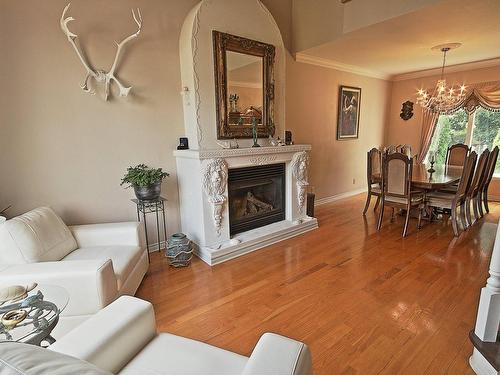 Vue d'ensemble - 74 Rue Antoine-Forestier, Carignan, QC - Indoor Photo Showing Living Room With Fireplace