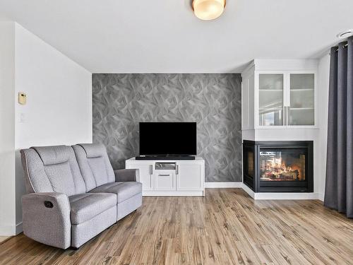 Living room - 302-507 Rue Castonguay, Saint-Jérôme, QC - Indoor Photo Showing Living Room With Fireplace