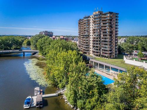 Back facade - 1503-4300 Place Des Cageux, Laval (Chomedey), QC - Outdoor With Body Of Water With View