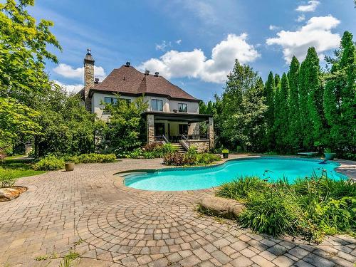 Cour - 134 Rue Du Chevalier-De-Chaumont, Carignan, QC - Outdoor With In Ground Pool