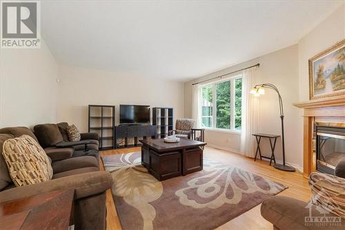 2121 Blue Willow Crescent, Ottawa, ON - Indoor Photo Showing Living Room With Fireplace