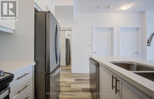 436 - 10 Mallard Trail E, Hamilton (Waterdown), ON - Indoor Photo Showing Kitchen With Double Sink