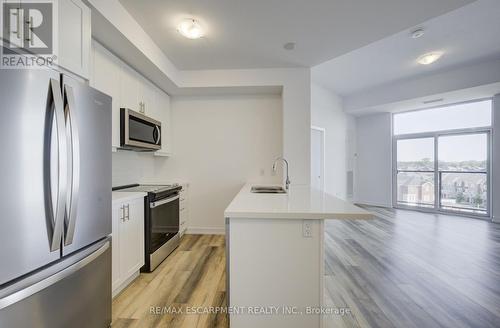 621 - 10 Mallard Trail, Hamilton (Waterdown), ON - Indoor Photo Showing Kitchen With Stainless Steel Kitchen With Double Sink With Upgraded Kitchen