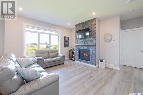 284 Cowan Crescent, Martensville, SK - Indoor Photo Showing Living Room With Fireplace