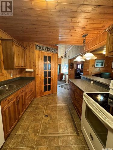 36 1St Street E, Weekes, SK - Indoor Photo Showing Kitchen With Double Sink