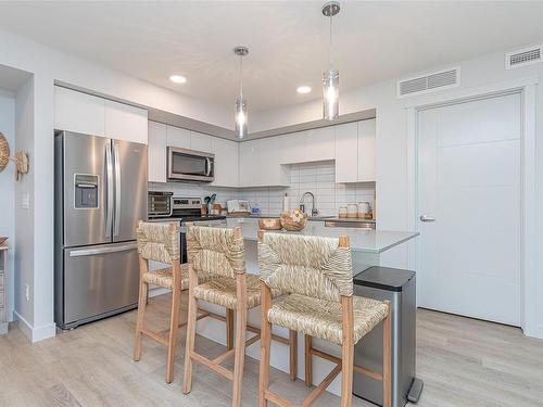 202-4810 Cedar Ridge Pl, Nanaimo, BC - Indoor Photo Showing Kitchen With Stainless Steel Kitchen With Upgraded Kitchen