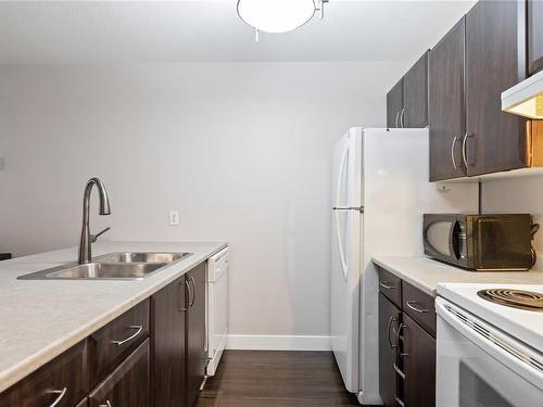 208-4971 Songbird Pl, Nanaimo, BC - Indoor Photo Showing Kitchen With Double Sink