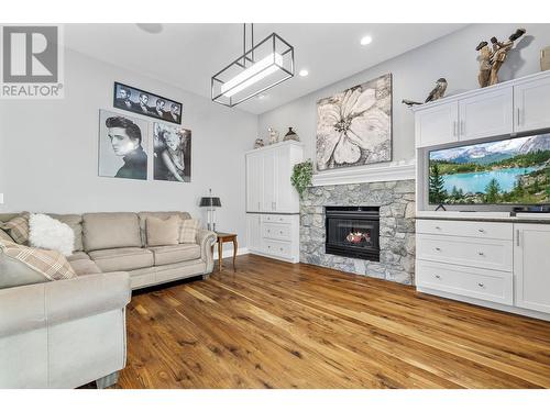 3945 Gallaghers Circle, Kelowna, BC - Indoor Photo Showing Living Room With Fireplace