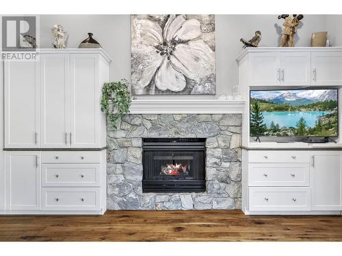 3945 Gallaghers Circle, Kelowna, BC - Indoor Photo Showing Living Room With Fireplace