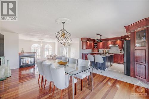 1135 Caprice Court, Ottawa, ON - Indoor Photo Showing Dining Room With Fireplace