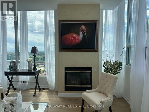 3404 - 220 Burnhamthorpe Road W, Mississauga, ON - Indoor Photo Showing Living Room With Fireplace