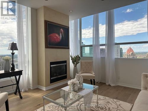 3404 - 220 Burnhamthorpe Road W, Mississauga, ON - Indoor Photo Showing Living Room With Fireplace