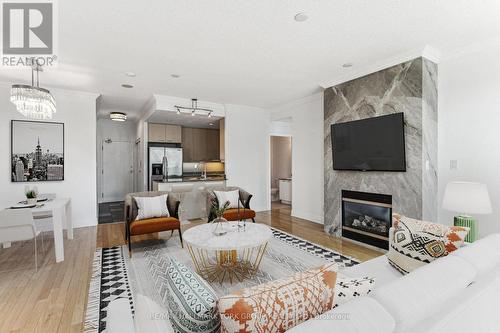 Ph304 - 88 Palace Pier Court, Toronto (Mimico), ON - Indoor Photo Showing Living Room With Fireplace