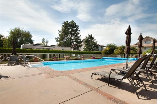 107-2300 Benvoulin Road, Kelowna, BC - Outdoor With In Ground Pool